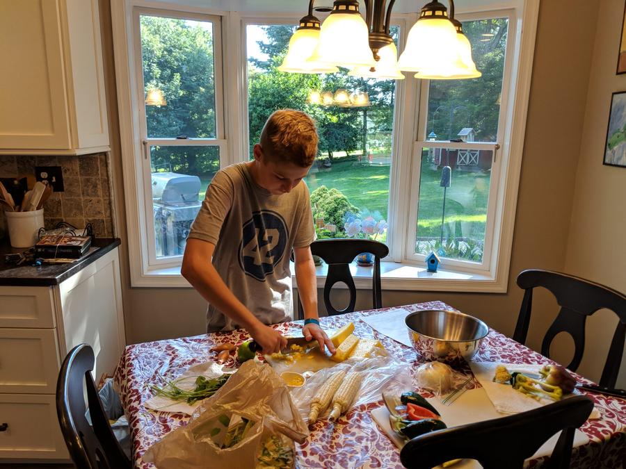 One camper prepping for a delicious meal at home.